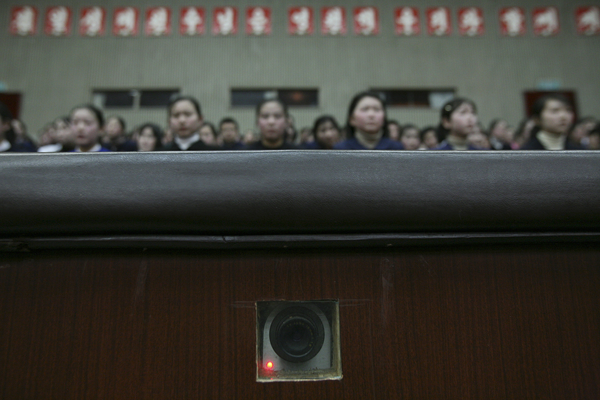A camera in the wall, used to film inside an auditorium at the Mangyongdae Schoolchildren's Palace in Pyongyang, North Korea, records as children wait for a performance to begin Wednesday, Feb. 27, 2008.